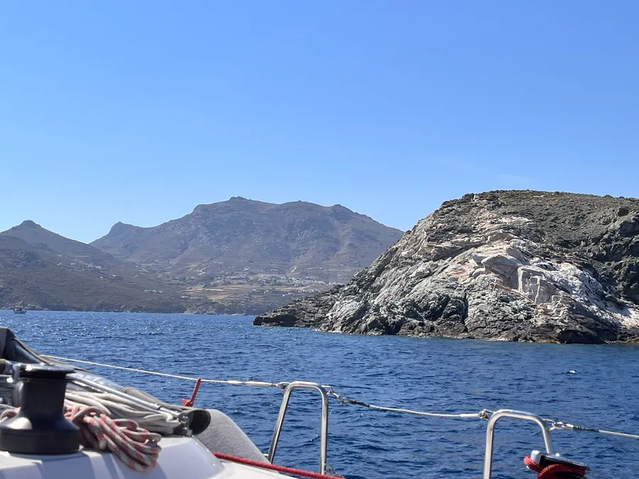 Rocky Greek coastline seen from the deck of a sailing boat